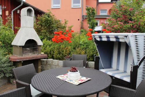 a table and chairs with a cake on top at Villa Harmonie in Lohme