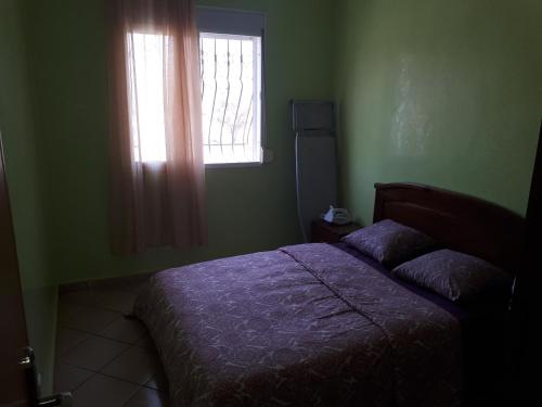 Llit o llits en una habitació de Agadir jet sakane 1 er étage