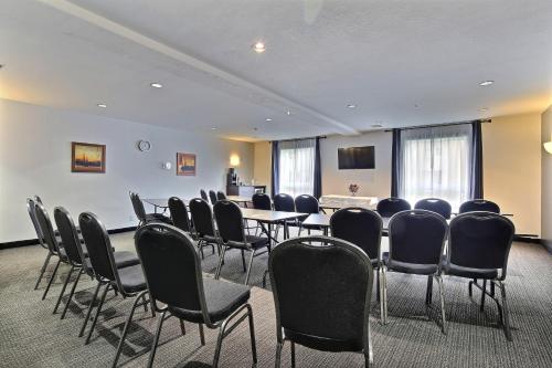 a conference room with chairs and a table in it at Super 8 by Wyndham Quebec City in Quebec City