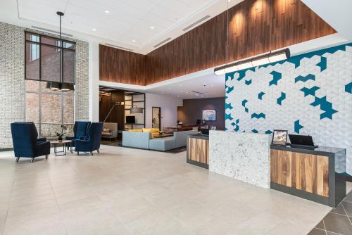 a lobby of a hotel with a reception desk at Hyatt Place Tampa/Wesley Chapel in Lutz