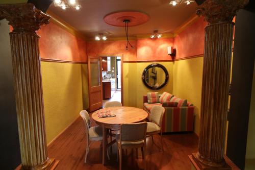 a dining room with a table and chairs at A La Carte Bed & Breakfast in Montréal