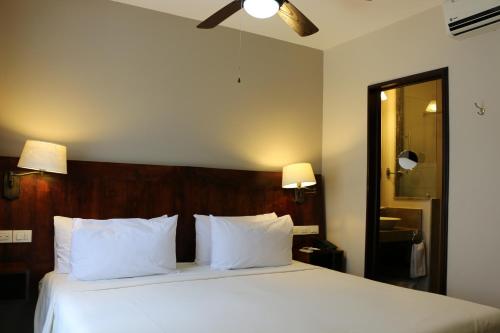 Llit o llits en una habitació de Hotel Villa Tequila