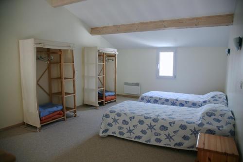Кровать или кровати в номере Hotel Residence Les Alizes
