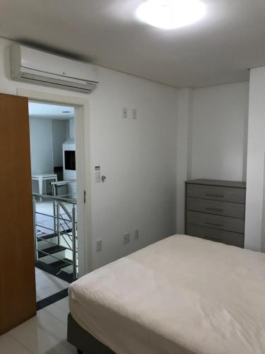 Katil atau katil-katil dalam bilik di Cobertura Duplex na Praia do Forte - 403