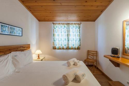 En eller flere senge i et værelse på Casas do Porto