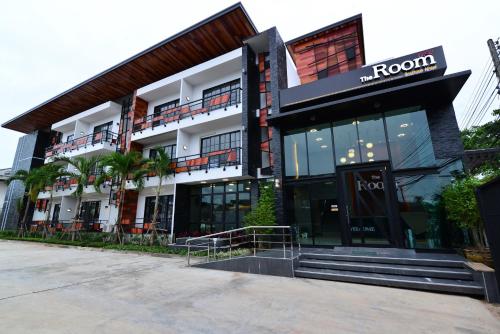 a front view of a building with a hotel at The Room Boutique Hotel in Sakon Nakhon