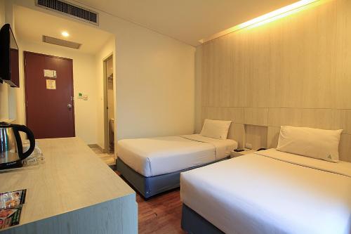 Katil atau katil-katil dalam bilik di Ten Stars Hotel