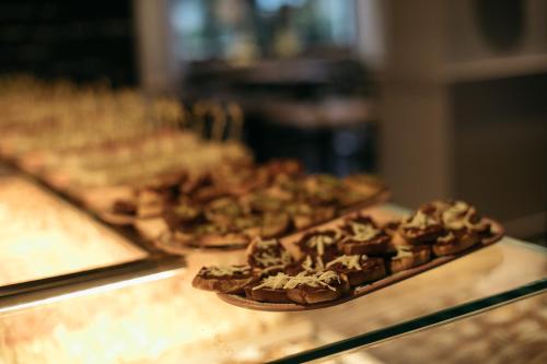 a group of pizzas sitting on top of a counter at Hotel Aloisi in Lecce