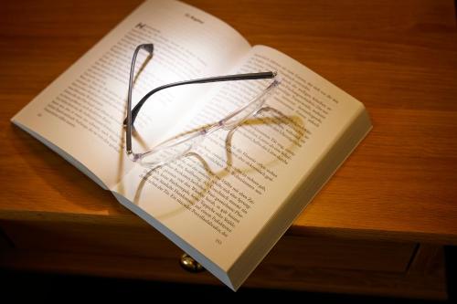 a book with a pair of glasses sitting on top of it at Engemann Kurve in Winterberg