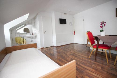 Ένα ή περισσότερα κρεβάτια σε δωμάτιο στο Hotel Olympia