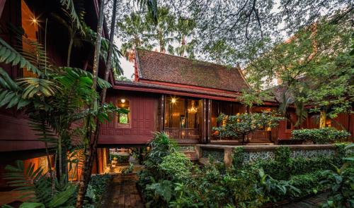 a house in the middle of a garden at House Of Papa Bangkok Siam in Bangkok