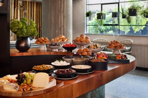 a buffet with many different types of food on a table at The Vera in Tel Aviv