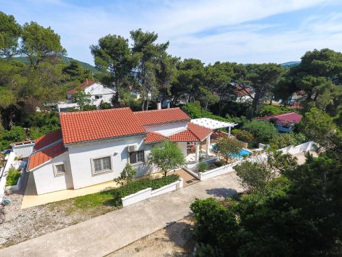 an aerial view of a house with red roofs at Spacious Holiday Home in Molat with Pool in Brgulje