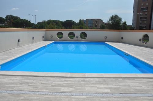 a large swimming pool on the roof of a building at La Mia Casa Romana in Rome