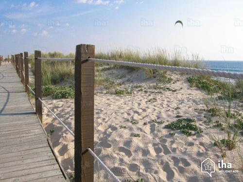 a boardwalk to the beach near the ocean at Lisbon Beach Apartments 6 in Costa da Caparica