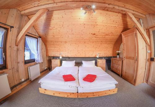 a bedroom with a bed in a wooden cabin at Guest House du Grand Paradis - On Piste in Champéry