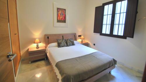 Posteľ alebo postele v izbe v ubytovaní Living-Sevilla Apartments San Lorenzo