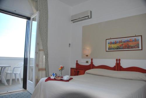 Postel nebo postele na pokoji v ubytování Hotel Incanto