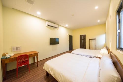 Una cama o camas en una habitación de 7-113 hotel