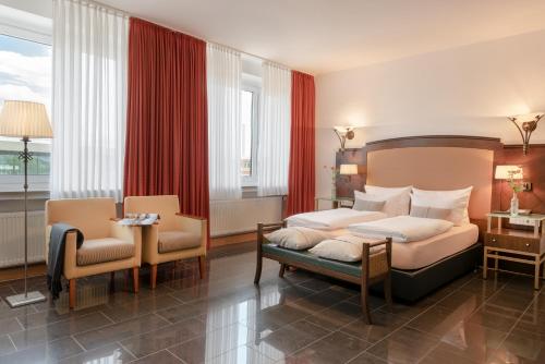Postel nebo postele na pokoji v ubytování Hotel Conti Am Hauptbahnhof