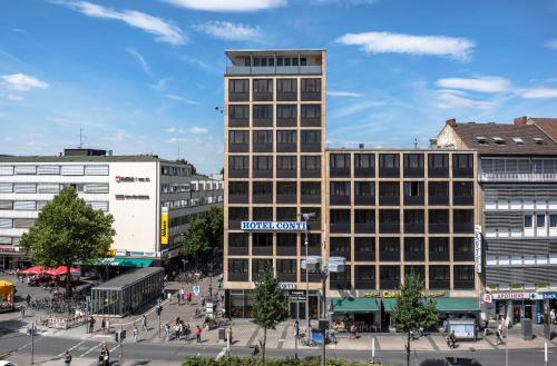 a tall building with a hotel room sign on it at Hotel Conti Am Hauptbahnhof in Münster