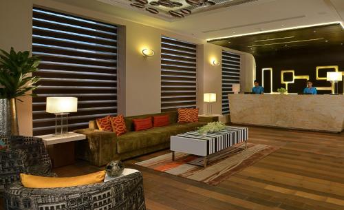 a living room with a couch and a table at Fortune District Centre, Ghaziabad - Member ITC Hotels' Group in Ghaziabad