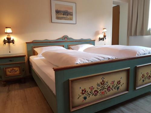 Postel nebo postele na pokoji v ubytování Hotel Landhaus Sonnenhof
