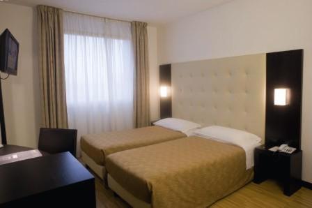 Ένα ή περισσότερα κρεβάτια σε δωμάτιο στο San Marco