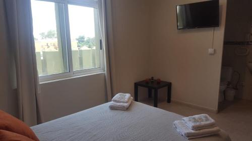 Postel nebo postele na pokoji v ubytování Hotel Castellverd