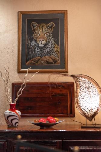 a picture of a jaguar sitting on a table at Blyde River Canyon Lodge in Hoedspruit