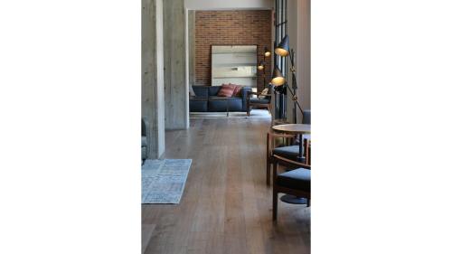 a living room with a couch and a table at c-hotels Diplomat in Florence