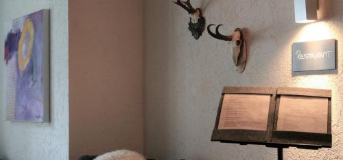 a corner of a room with a sign on a wall at MONTAFONLodge in Gaschurn