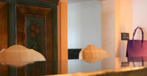 a reflection of a bag in a mirror at MONTAFONLodge in Gaschurn