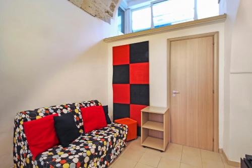 a living room with a couch and a door at B&B Affittacamere Del Teatro in Brindisi
