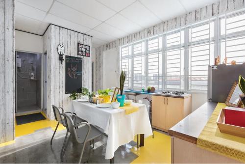 a kitchen with a table and chairs in a room at @ DE GARDEN ** AEON•IKEA•TESCO•THEMED• DESA TEBRAU JOHOR BAHRU in Johor Bahru
