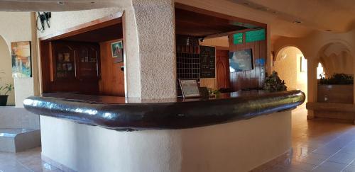 a counter in a building with a fake submarine on it at Costa Miramar in Acapulco