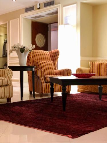 a living room with a couch and a table at Hotel Miramare & Spa in Sestri Levante