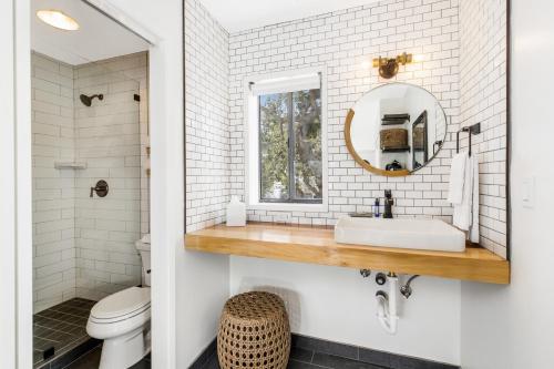 a bathroom with a sink and a mirror at Haley Hotel in Santa Barbara