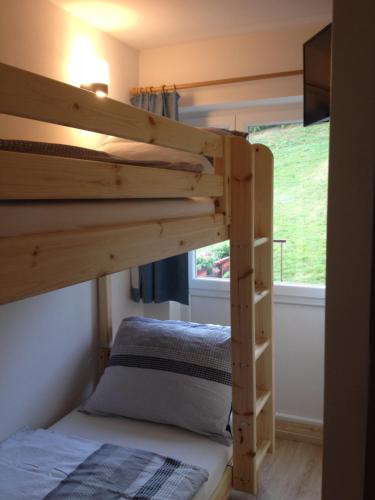 a couple of bunk beds in a room at Gailtal Panorama in Kötschach