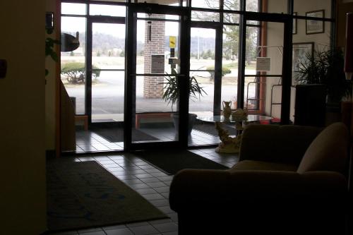 an open door to a living room with a couch at Lodi Valley Suites in Lodi