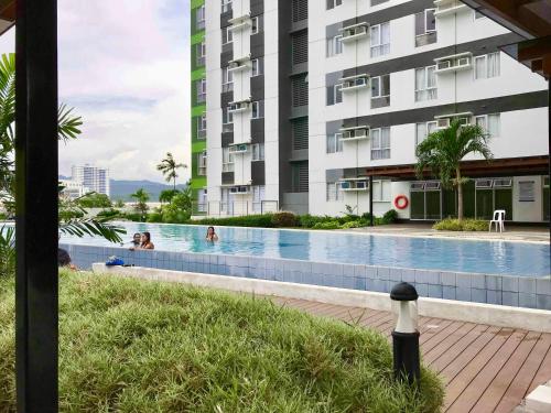 a swimming pool in front of a building at *NEW* 2-Bedroom PENTHOUSE Condo Unit Centrio Tower(beside Ayala Centrio Mall) Downtown CDOC in Cagayan de Oro
