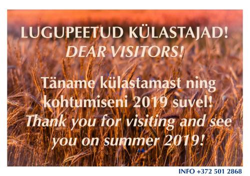 a poster with a picture of a field of grass at Rosma Mill Holiday House in Põlva