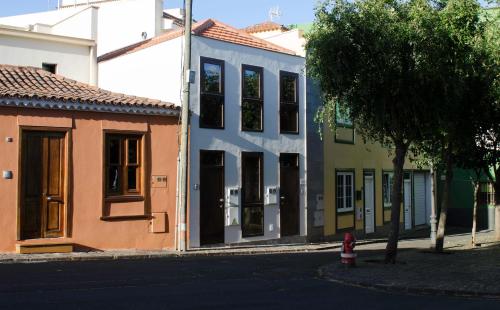a group of buildings on a city street at Plaza San Benito in Las Lagunas