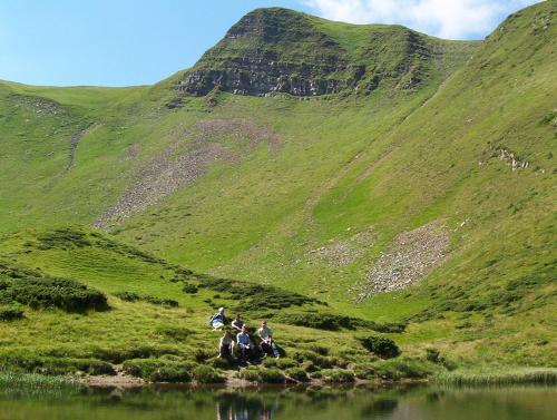 a group of people riding horses near a mountain at Аня Рома in Lazeshchyna
