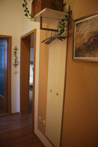 a hallway with a mirror in a room at Von-Thünen in Schwerin