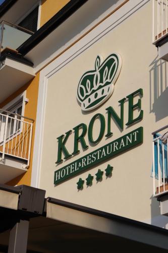 a sign on the side of a hotel at Hotel Krone in Mondsee