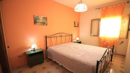 Tempat tidur dalam kamar di Villetta Eraclito