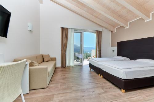 Posteľ alebo postele v izbe v ubytovaní Maso Tobel Riva del Garda