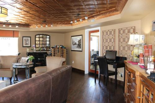 
a living room filled with furniture and a large window at Historian Inn in Gardnerville
