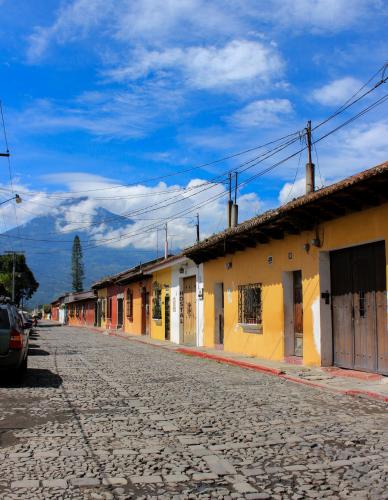 an empty street with a row of buildings at Hotel Real Antigua in Antigua Guatemala